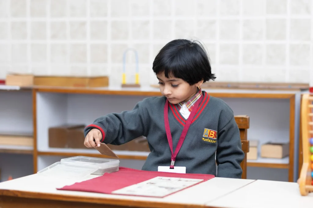 Montessori school classroom with children engaged in activities